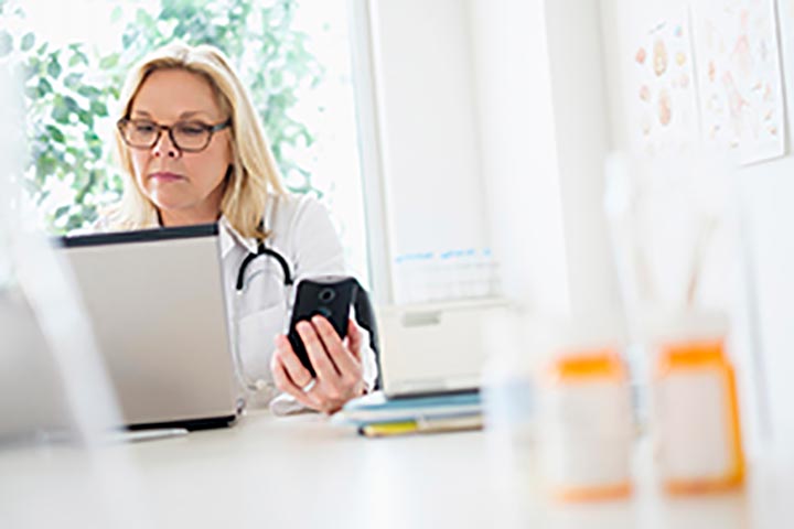 Doctor looking at computer screen