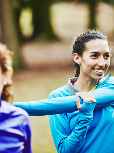 Young woman warming up for exercise