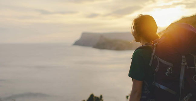 Woman looking at the sunset