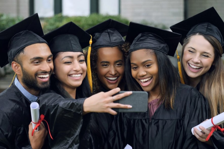 graduating students taking selfie
