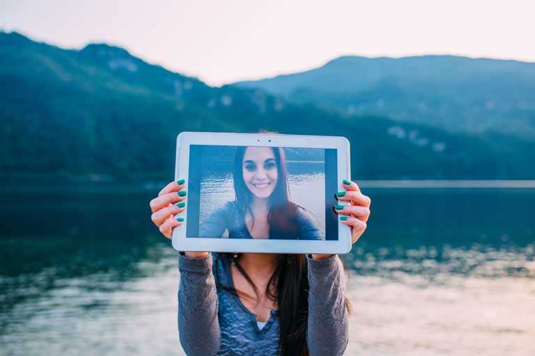 Girls holding ipad