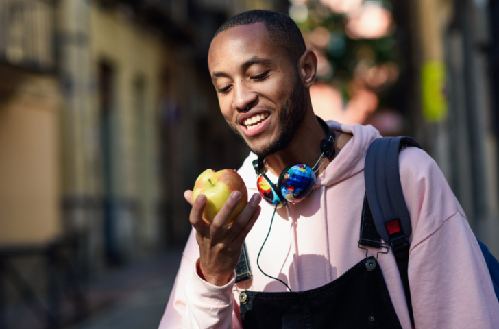 Man eating apple