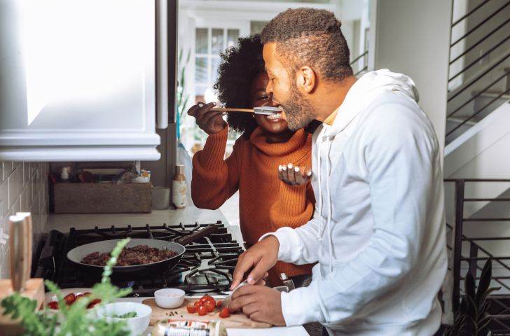 Man and woman cooking together