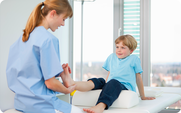Child having feet checked