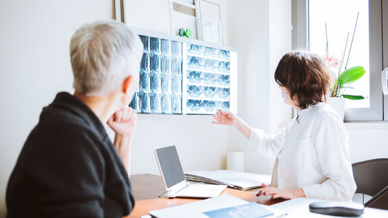 Specialist consulting with a patient