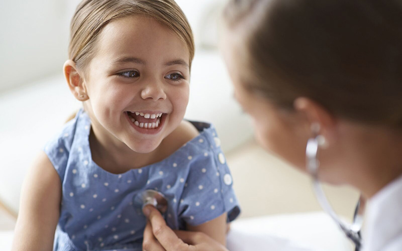 A child being examined by a healthcare professional.