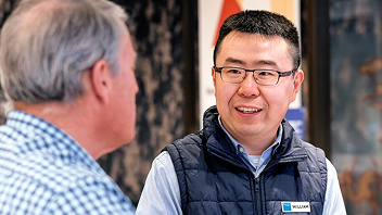A Bupa staff member speaking with a customer.