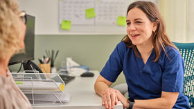 Healthcare professional talking to a patient