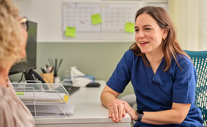 Healthcare professional talking to a patient