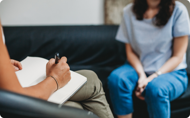 Woman sitting with mental health social worker